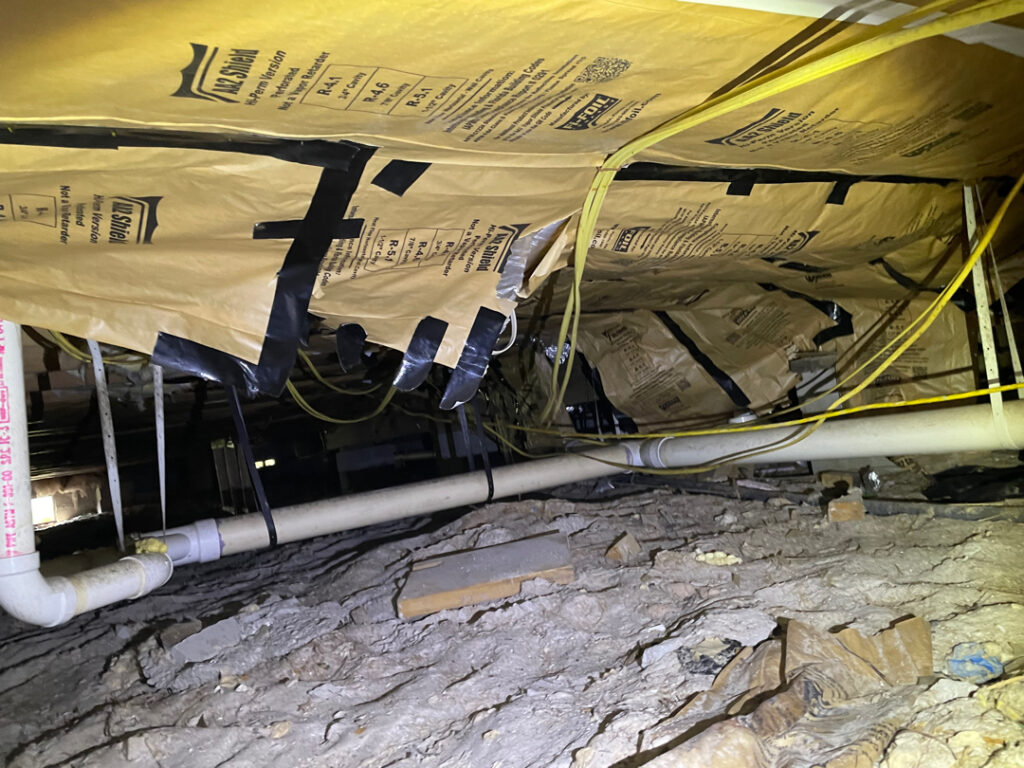 The foundation under the home in the crawl space is damaged from the significant hurricane flooding event