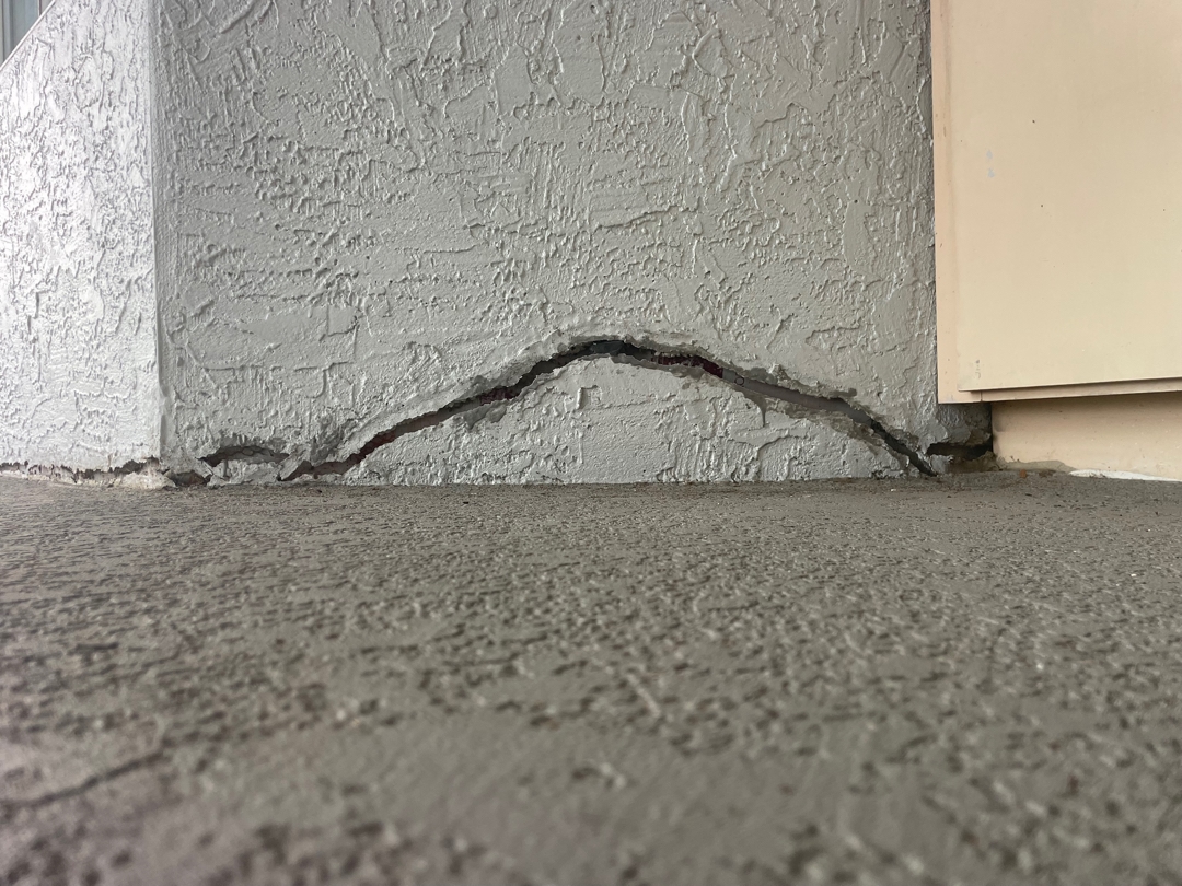 cracked and sunken concrete