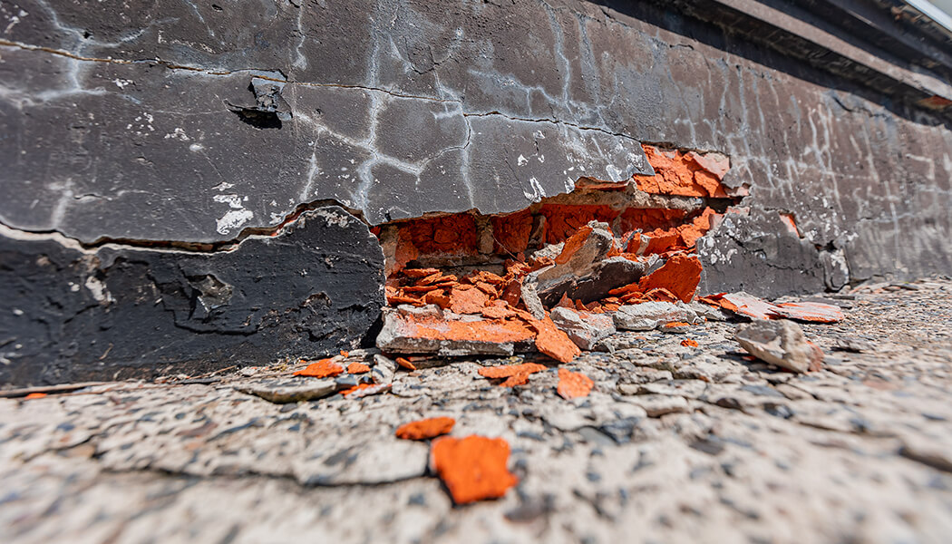 Close up of large badly damaged brick wall from foundation issues.