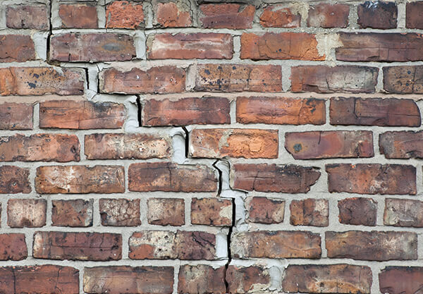 Cracked brick from foundation damage.