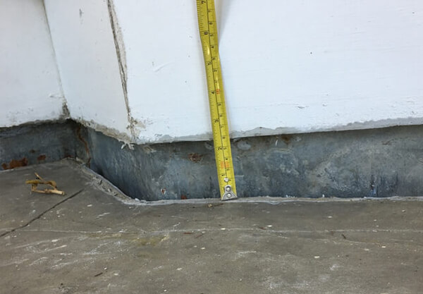 Concrete slab is sunken down and needs concrete lifting.