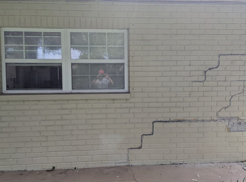 crack on brick wall from a settling foundation