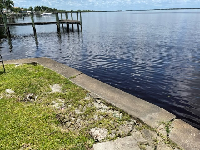 damage seawall with visible cracking