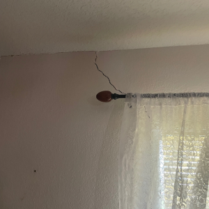 crack in window corner from sinking foundation
